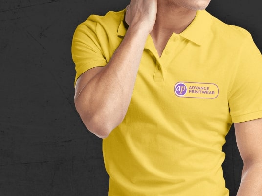 Man wearing a yellow Advance Printwear polo shirt