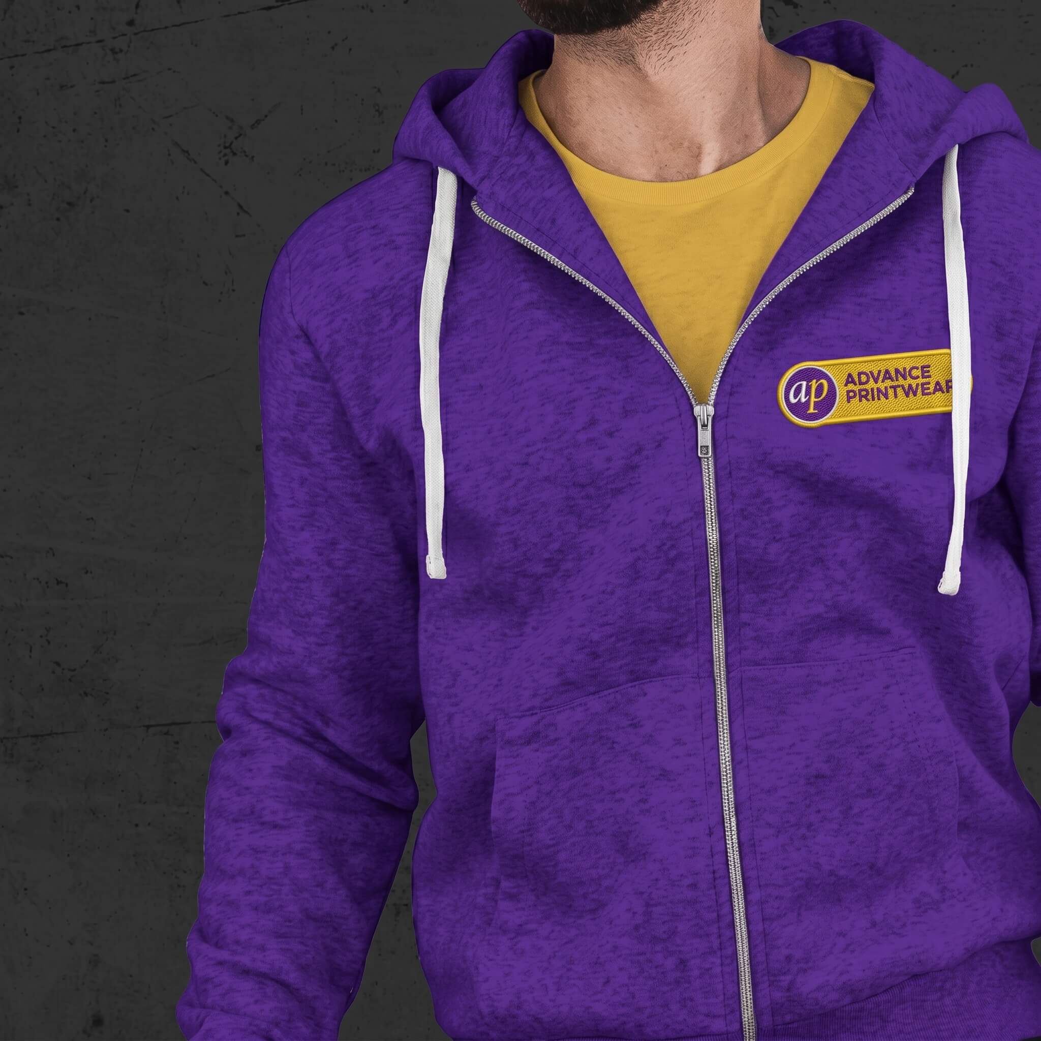 embroidered logo on a hoodie in purple and yellow