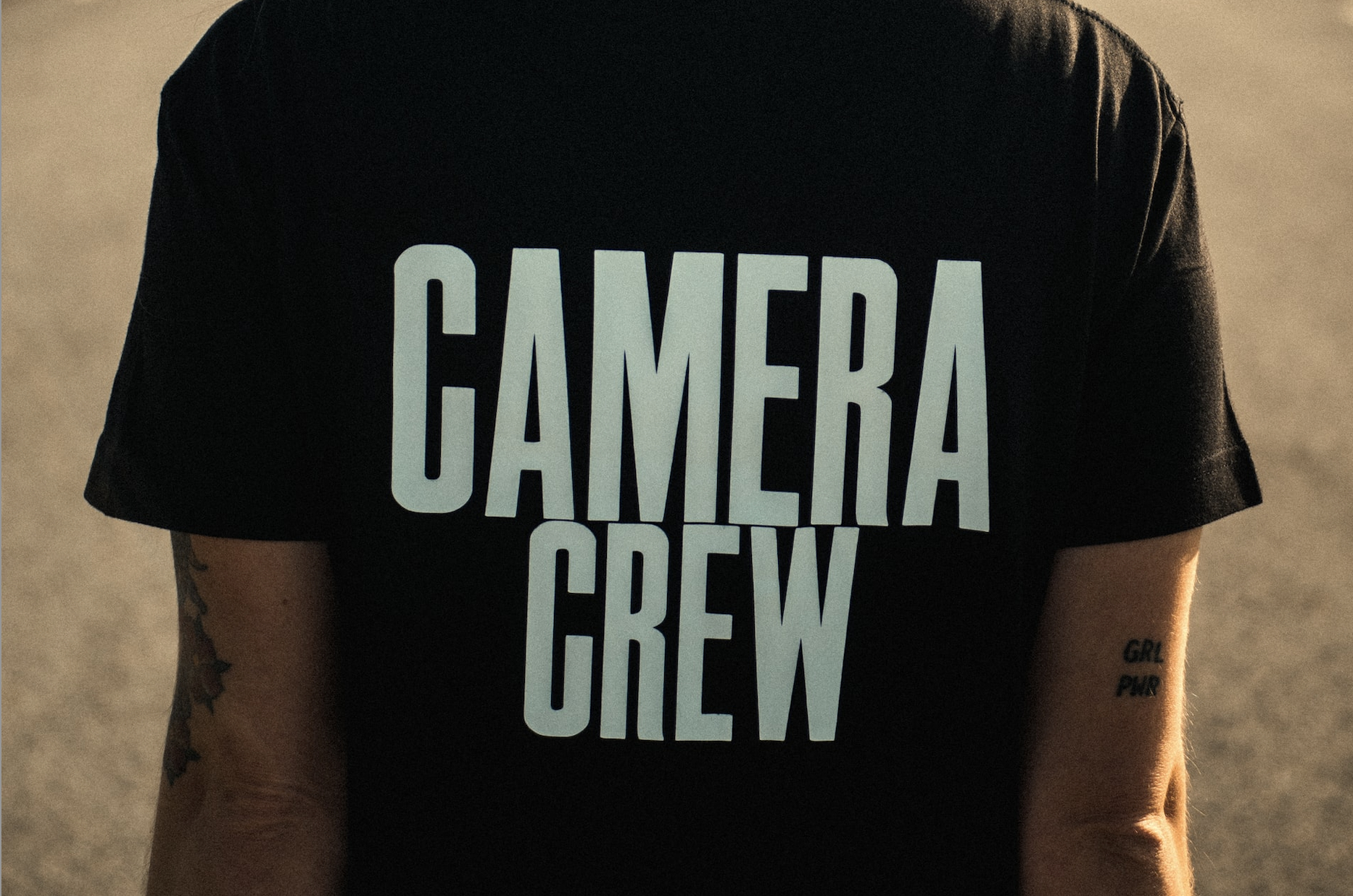 T-shirt with camera crew printed on it